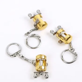 1 gab Radošo Zelta Krāsā Lidot Ruļļa Atslēgu piekariņi Velcēšanas Spoles Modeli Zvejas Metal Keychain Rīksti Nelielu Kulonu Zvejas Mīļāko
